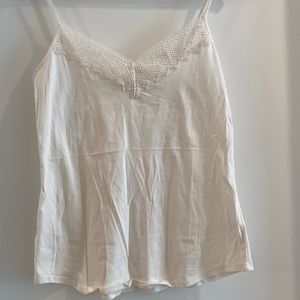Off white tank top with clear stitching on the top